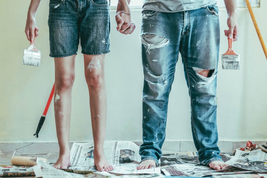 Two decorators holding paint brushes
